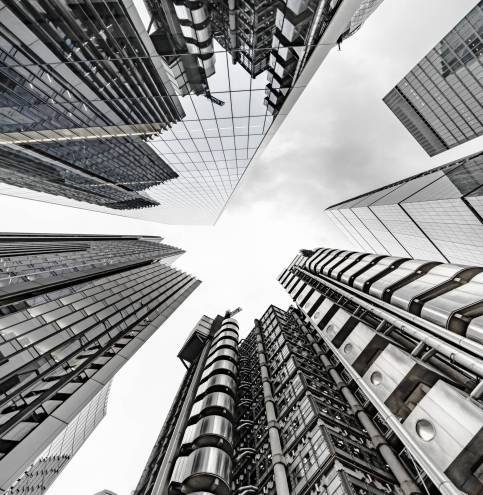 Vertical low angle shot of a modern business building scenery touching the sky İzmir İnşaat